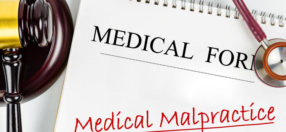 Medical Form With Words Medical Malpractice And Judge's Hammer G